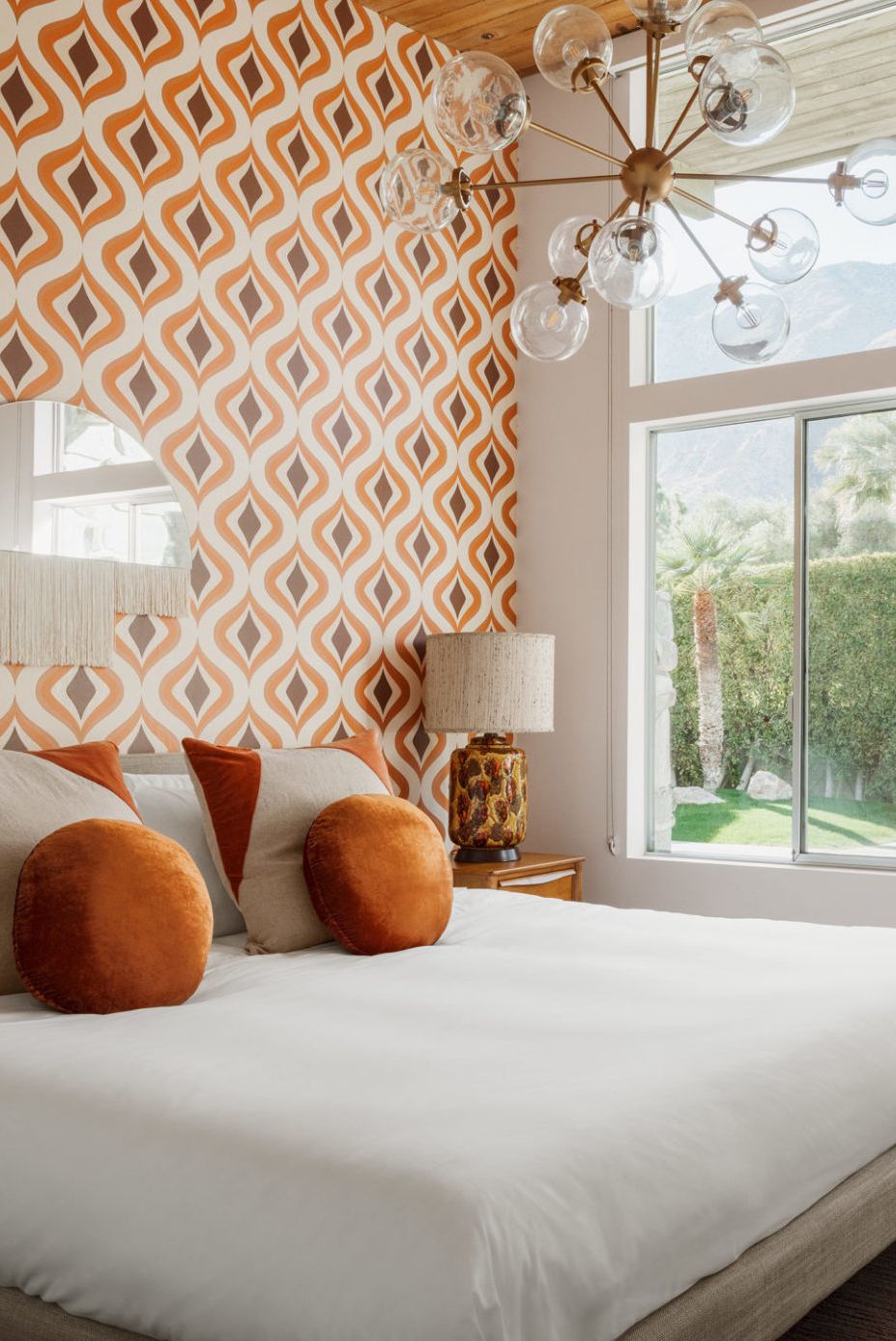 bedroom accent wall with orange and red pattern