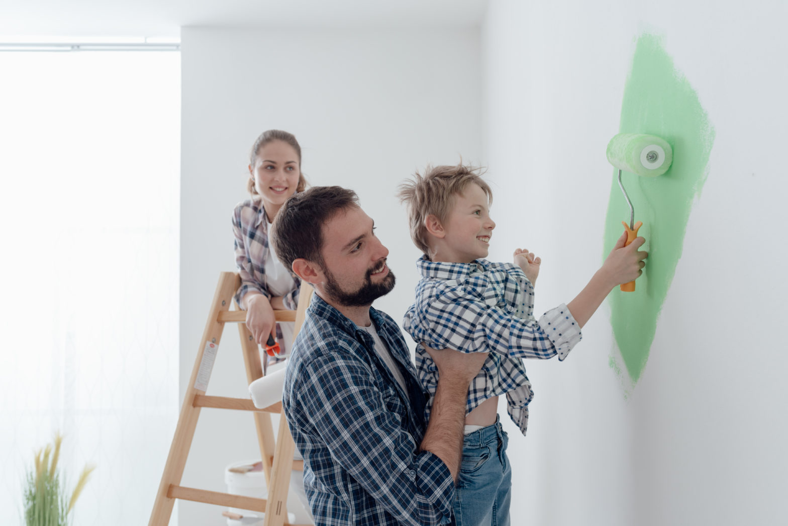 happy young family renovating their home